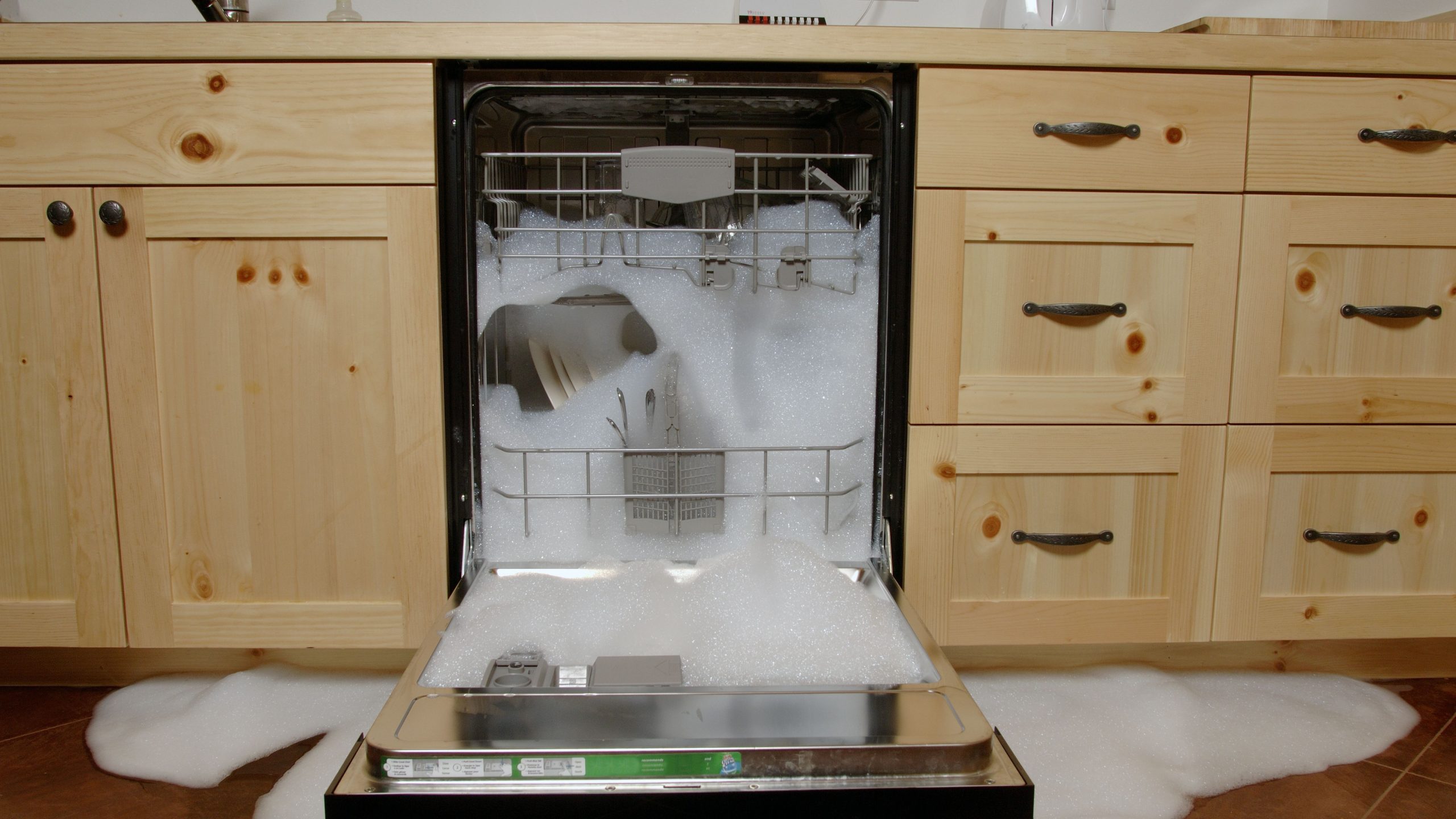 dishwasher overflowing with sud scaled